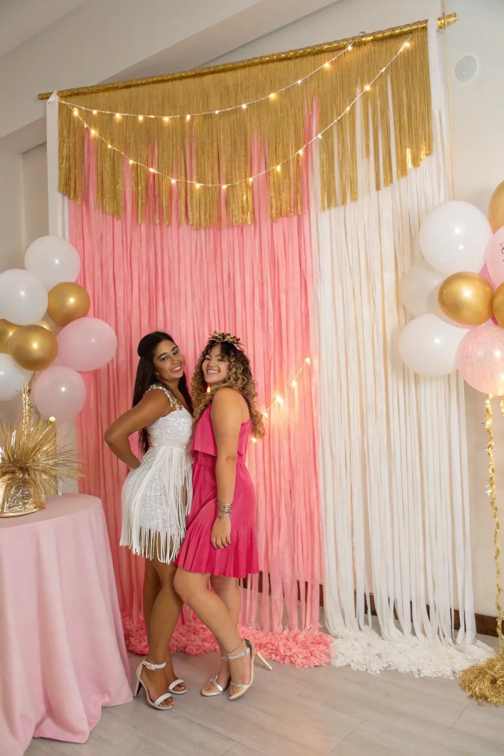 A dramatic fringe backdrop in pink, gold, and white.