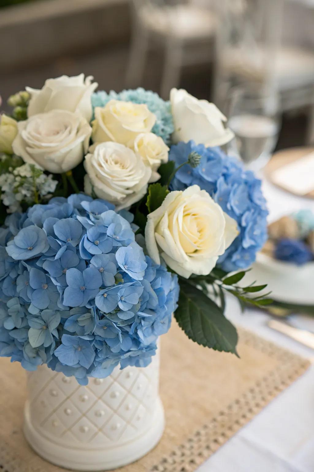Azure hydrangeas intermingle with ivory roses, creating eternal beauty.