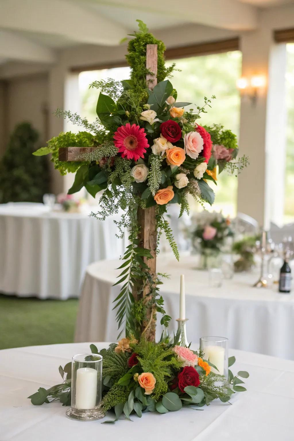 A botanical cross centerpiece contributes an elegant and meaningful touch to the table.