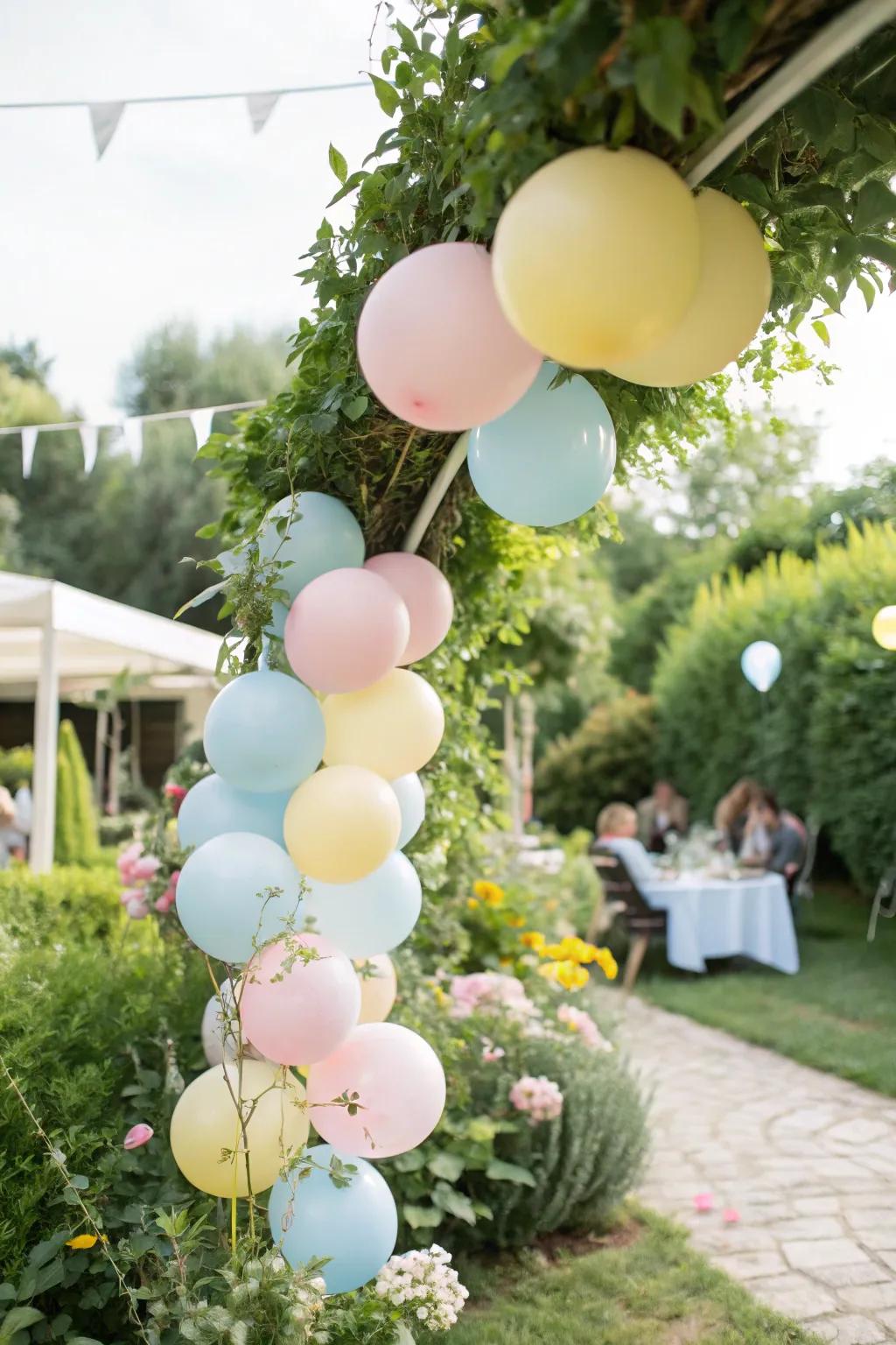Enchanting pastel balloon garland perfect for garden celebrations.