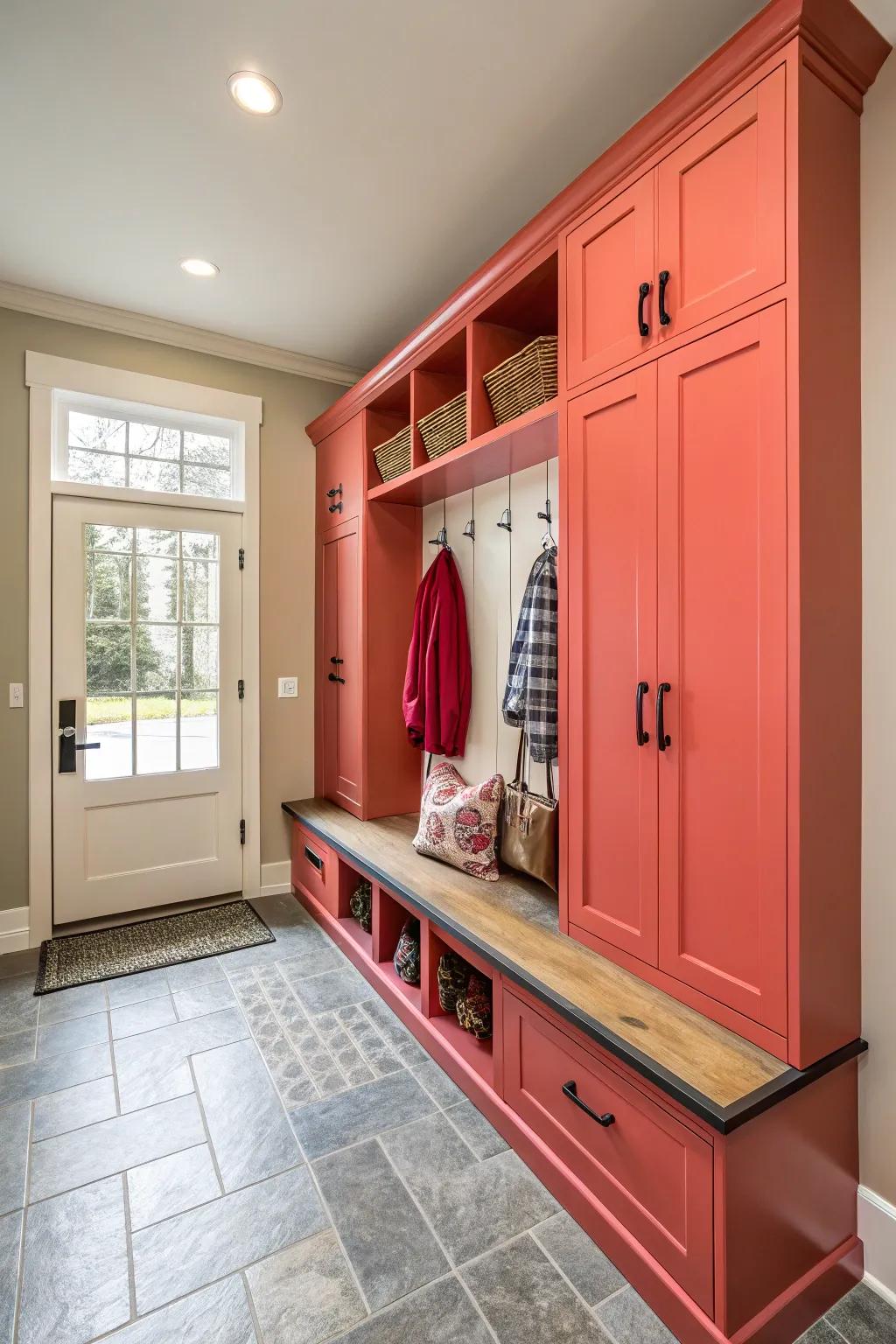 Bright cabinets bring a sense of personality and warmth to the mudroom.