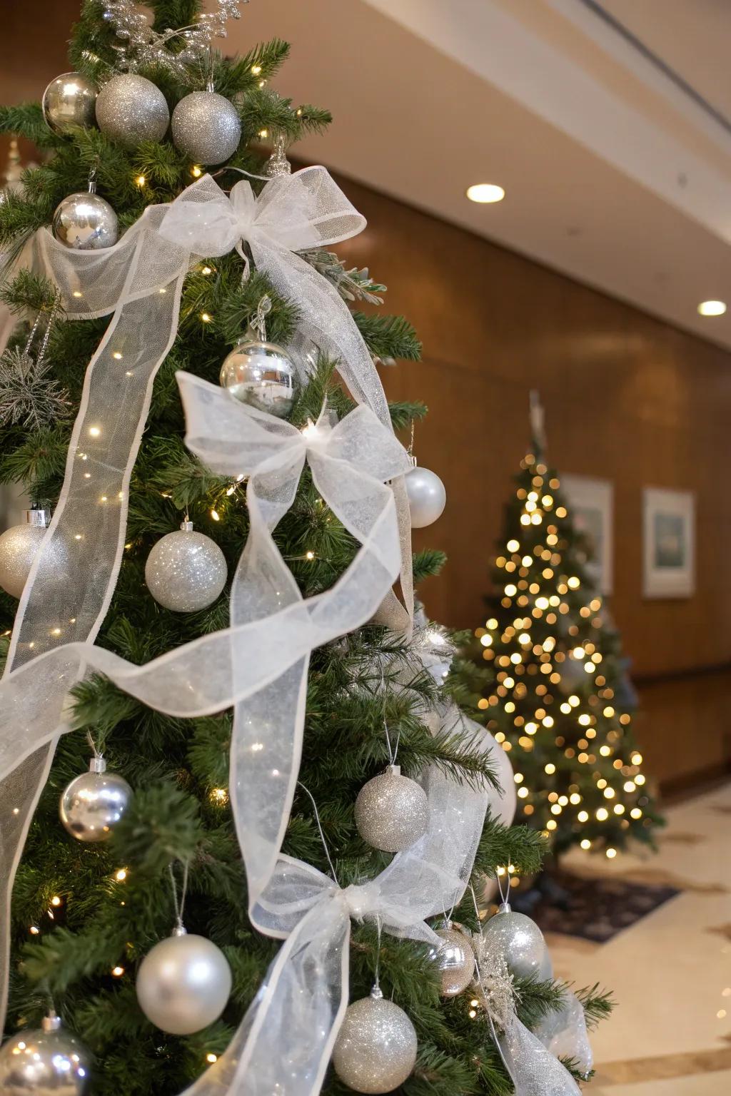 White ribbons add a soft, elegant touch to the tree.
