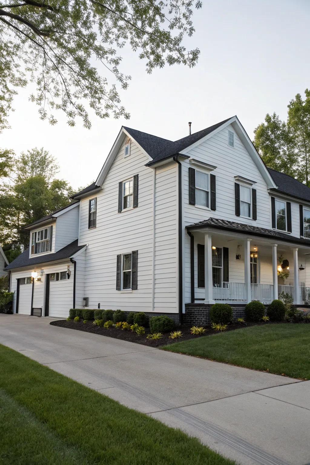 A house presenting a striking contrast using white vinyl siding and dark trim.