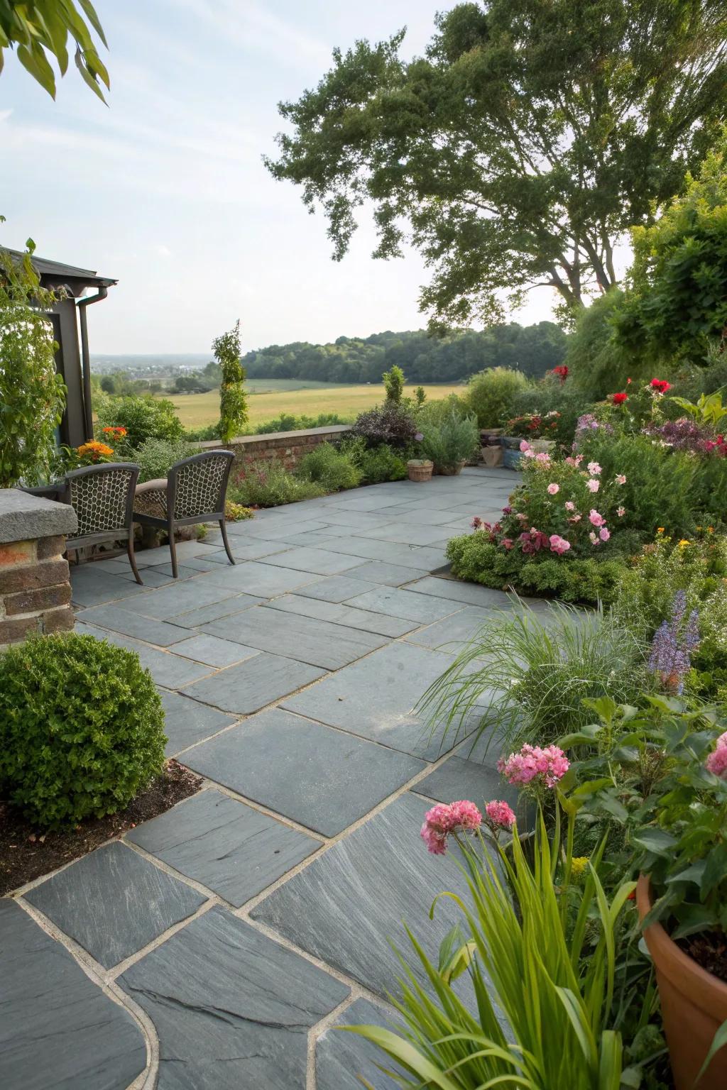A slate patio beautifully merged with abundant vegetation.