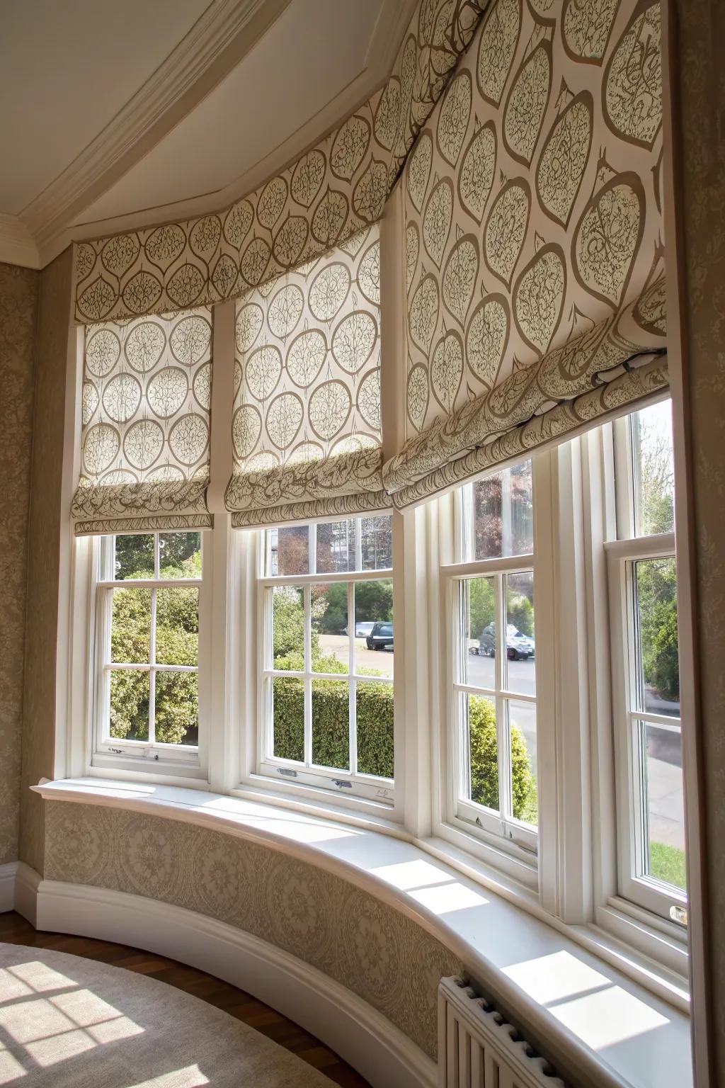 Chic roller shades that enhance a curved bay window.