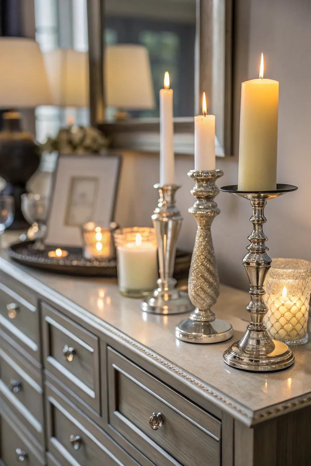 Candles introduce warmth and class to the dresser decor.