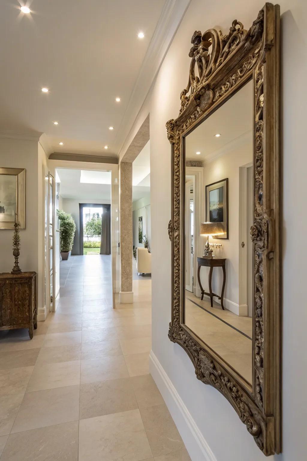 A vintage mirror enhancing light and space in a hallway.