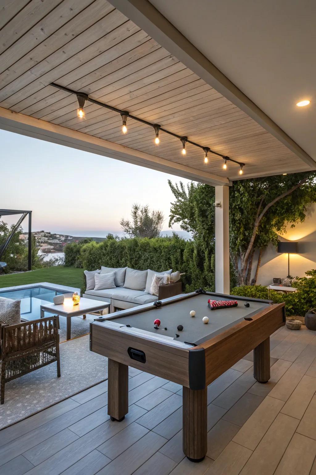 A multi-purpose outdoor area with a pool table and relaxing lounge.