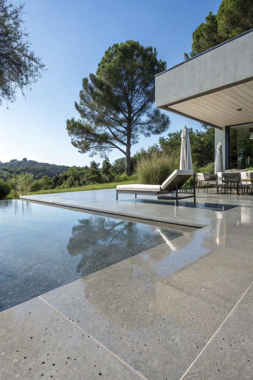 Polished concrete provides a chic and modern aesthetic to the poolside.