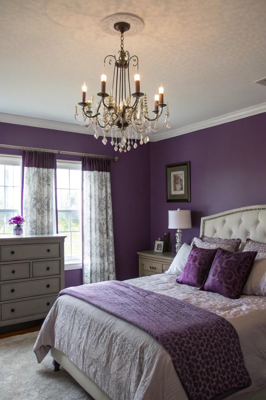 A standout chandelier lighting up violet walls elegantly.