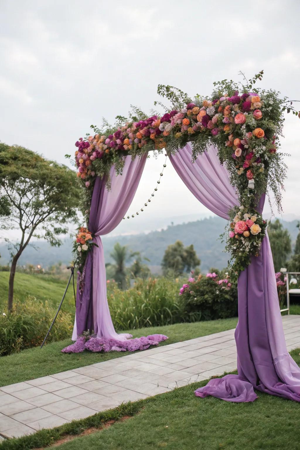 A violet draped ceremony arch delivers a romantic focal point.