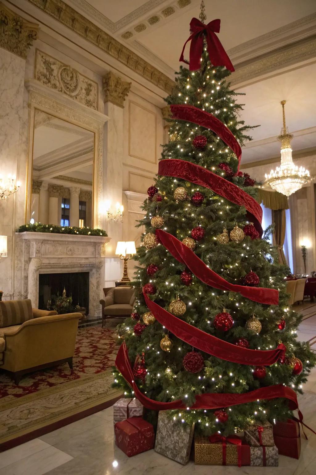 Glamorous Christmas tree with red velvet ribbons
