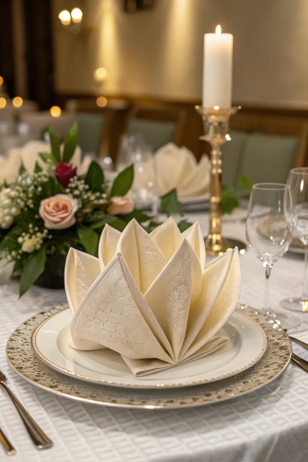 A silken cloth gently arranged into a bloom, bringing a natural refinement to the table.