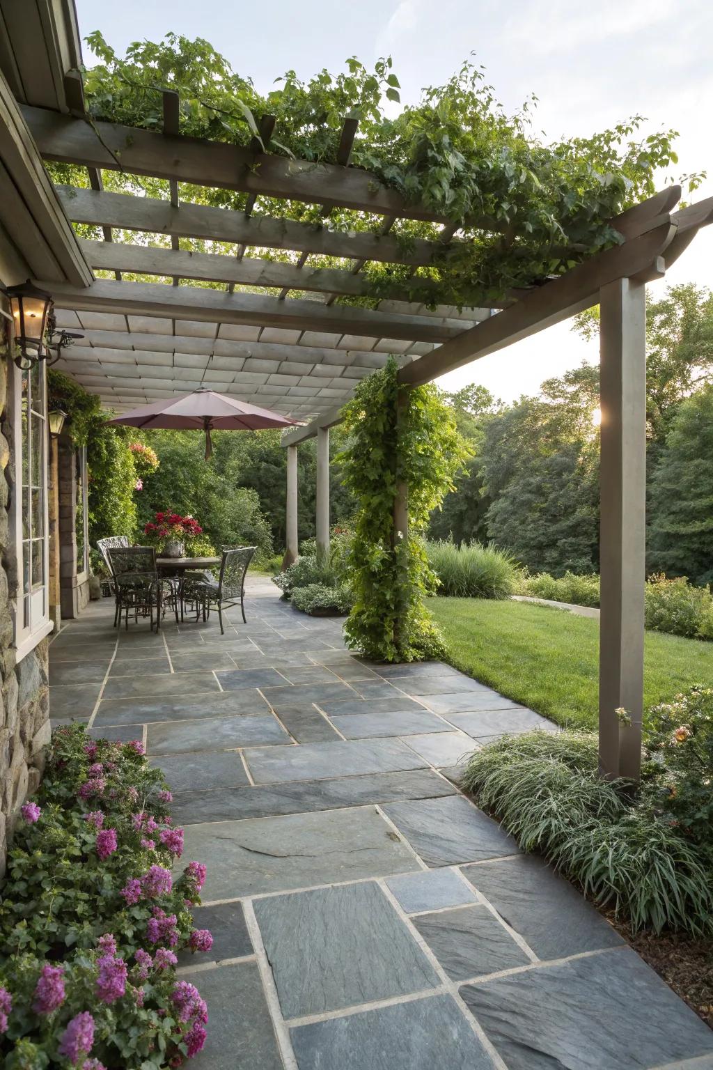 A slate patio elevated by a timber trellis.