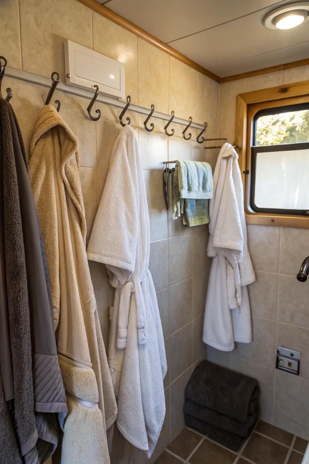Hangers make it quick to get towels and bathrobes when inside a mobile home restroom.