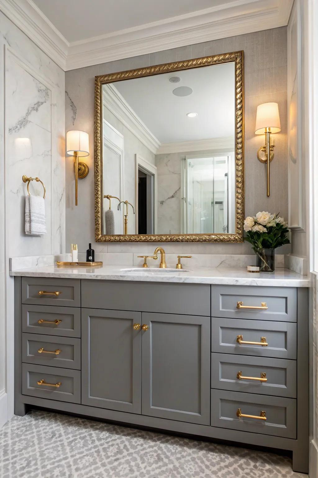 A glamorous bathroom features a gray vanity accented with metallic elements.