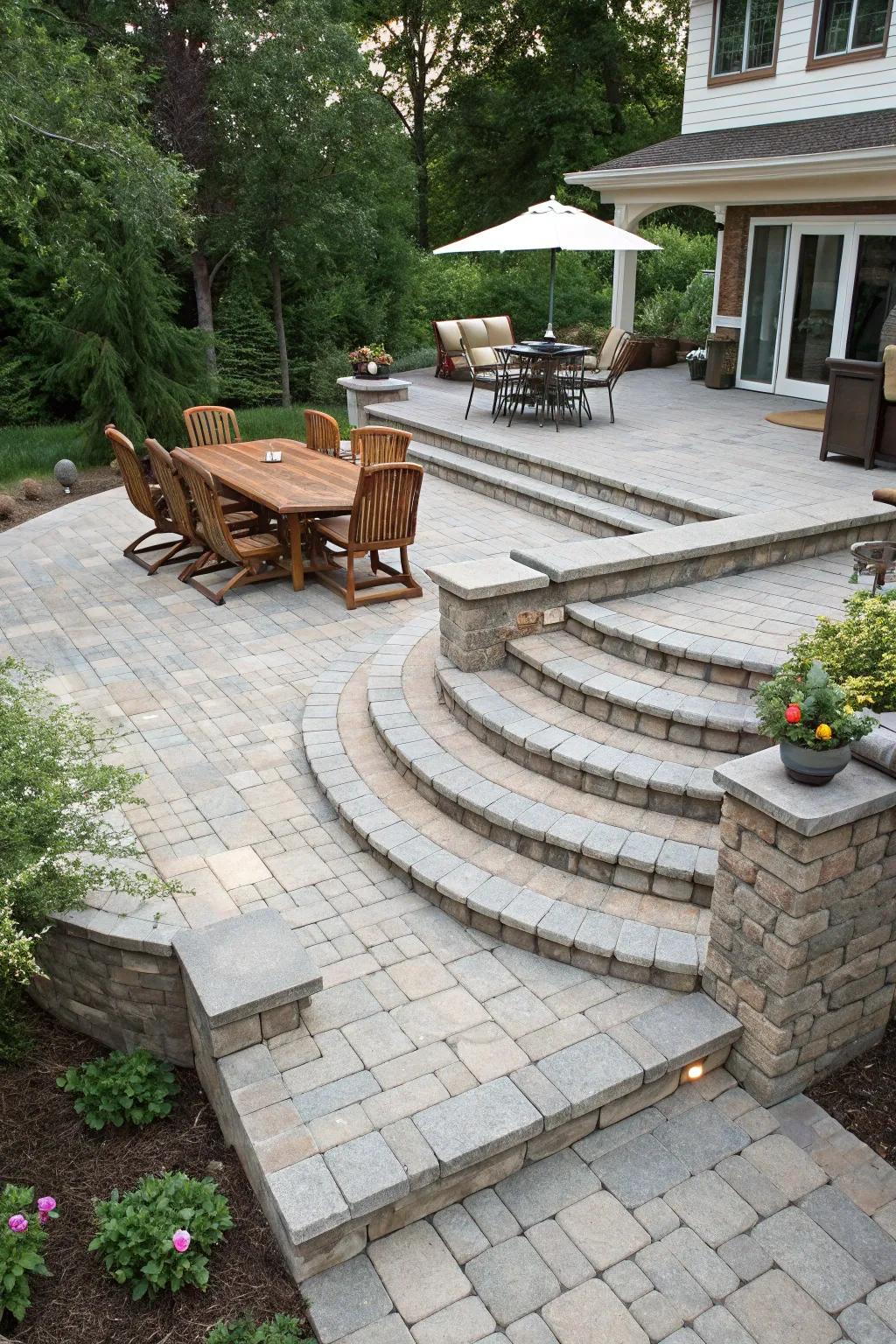 A multi-level paver patio with unique areas for feasting and relaxation.