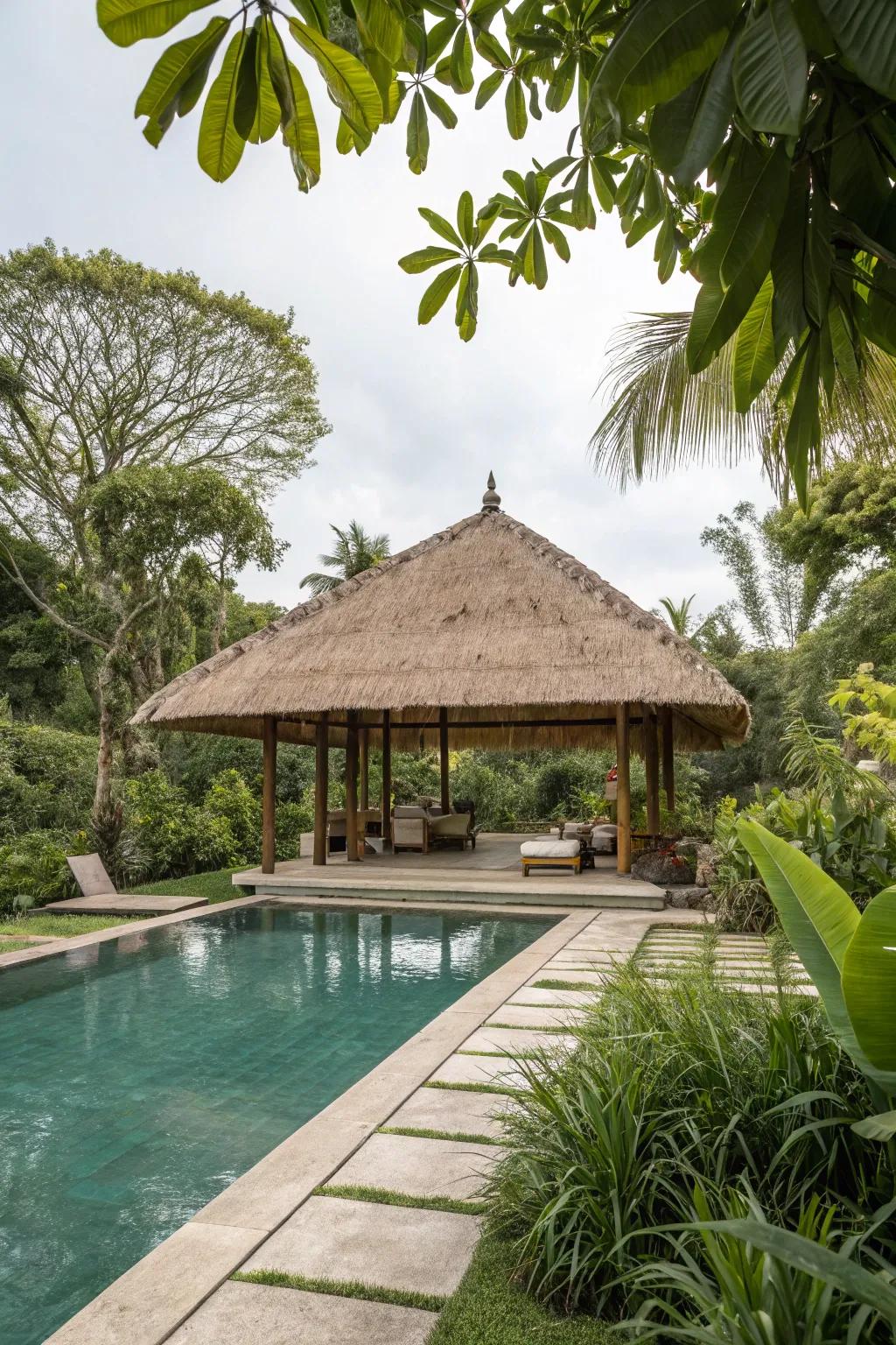A thatched roof pavilion creates a tropical getaway in your backyard.