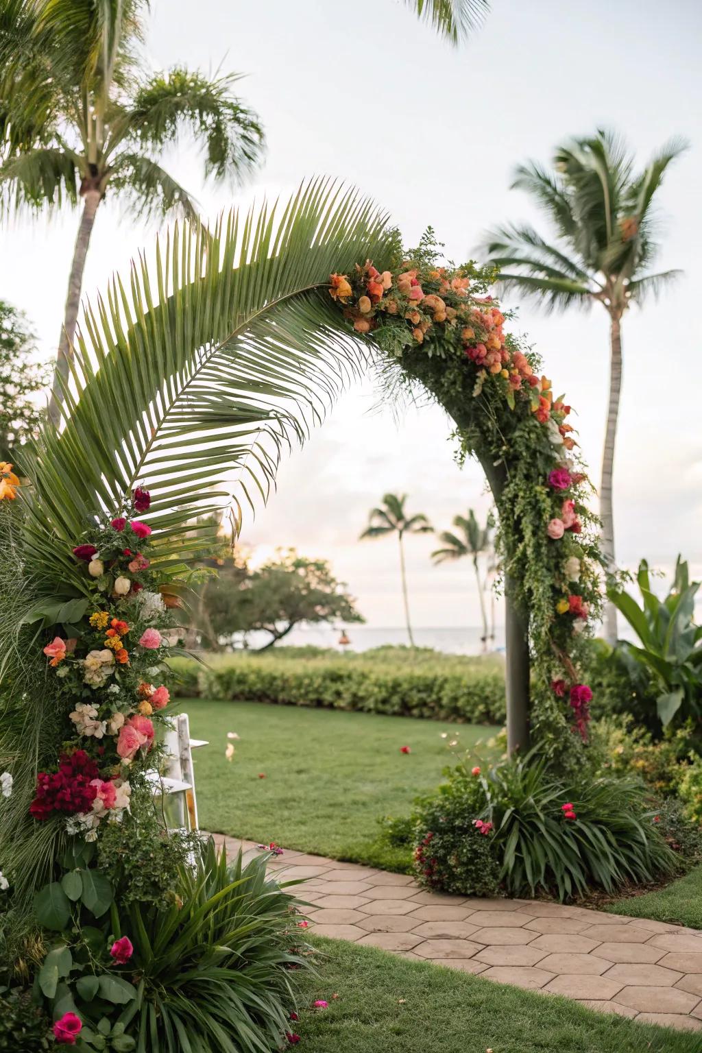 An exotic arch bedecked with palm fronds and vibrant flowers.