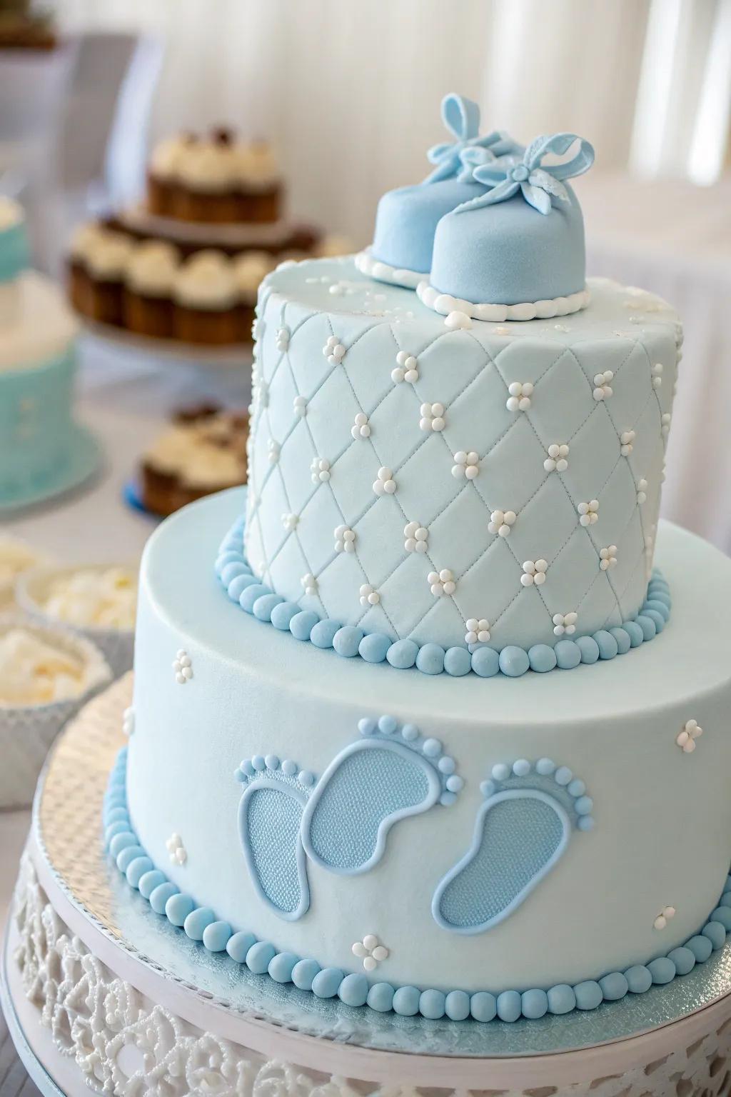 A sweet cake featuring tiny baby feet for a baby boy shower.