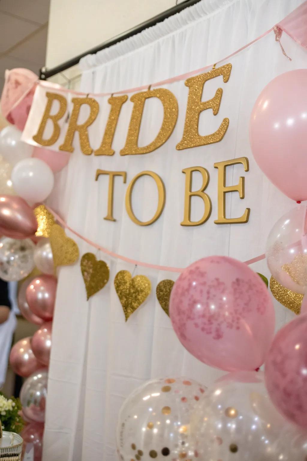A catchy 'Bride to Be' banner in pink and gold.