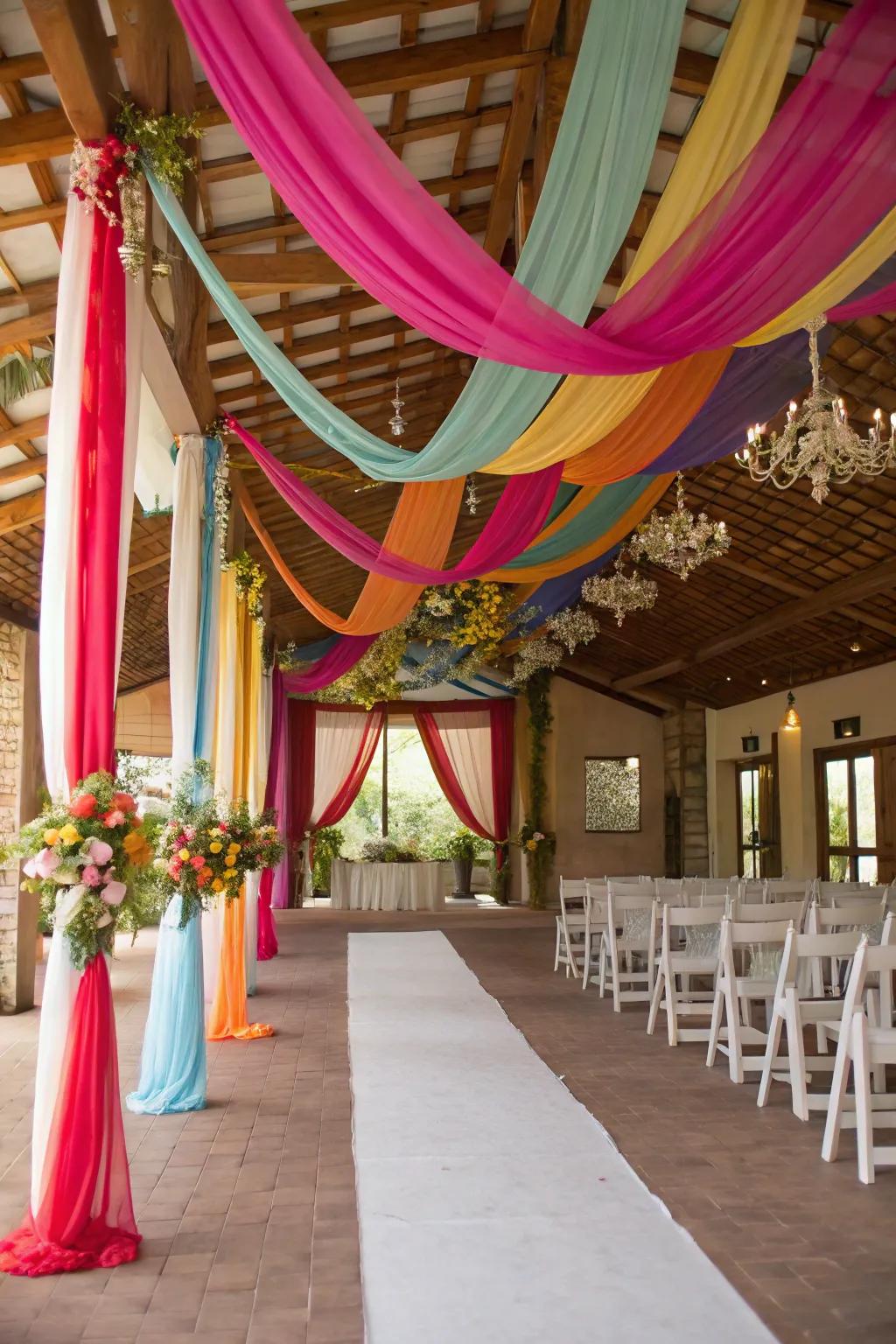 A wedding venue dazzles with vibrant rainbow drapery, creating an atmosphere of pure celebration.