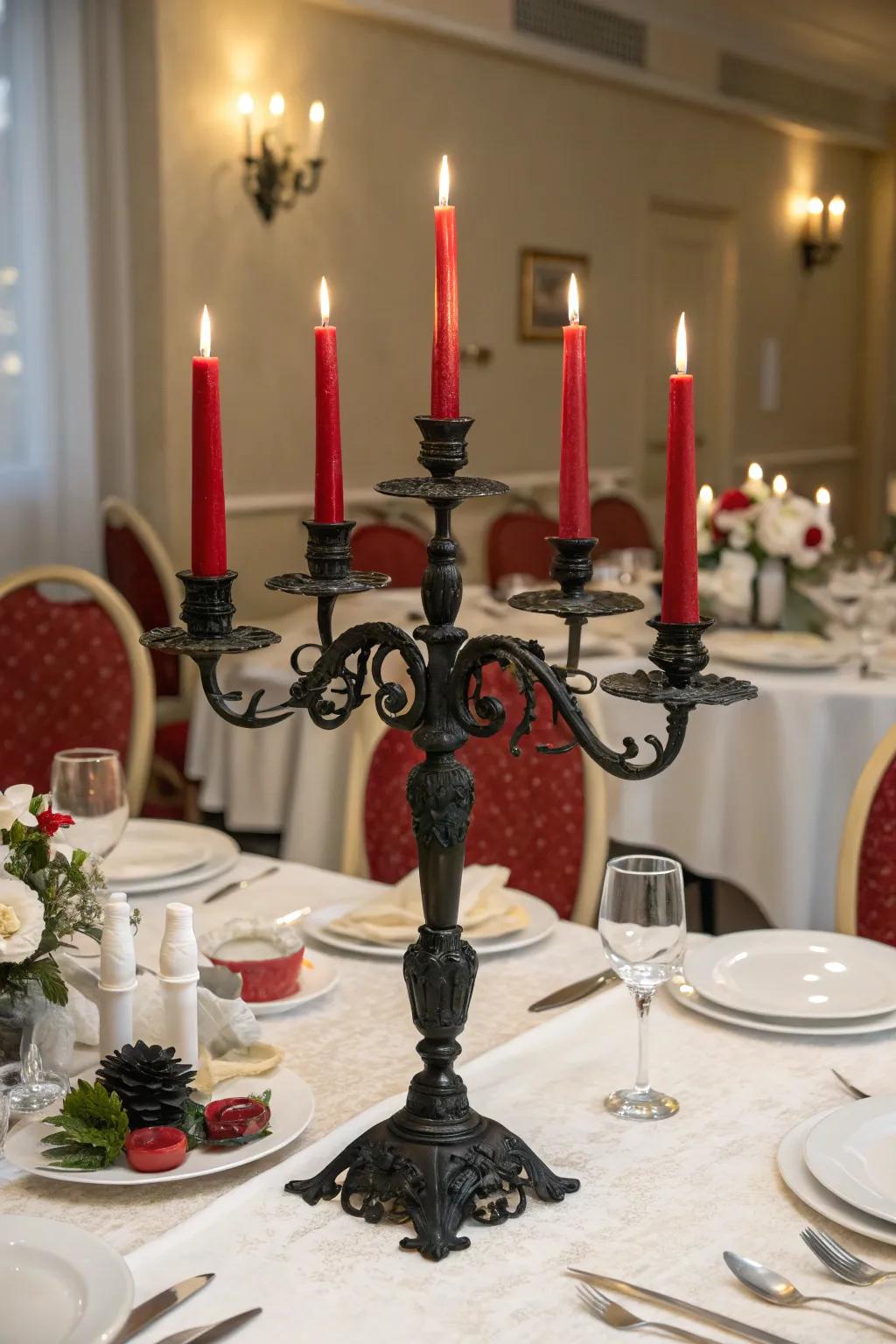 A ceremonial dining arrangement showcasing an obsidian candelabra and scarlet tapering lights.
