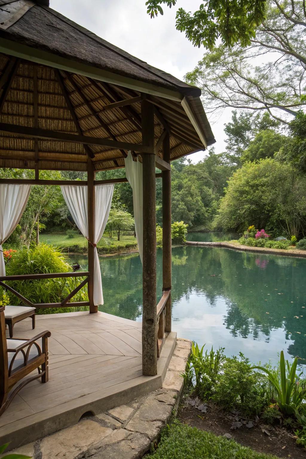 This stylish covered spot offers shade and a stunning view of the swimming pond.