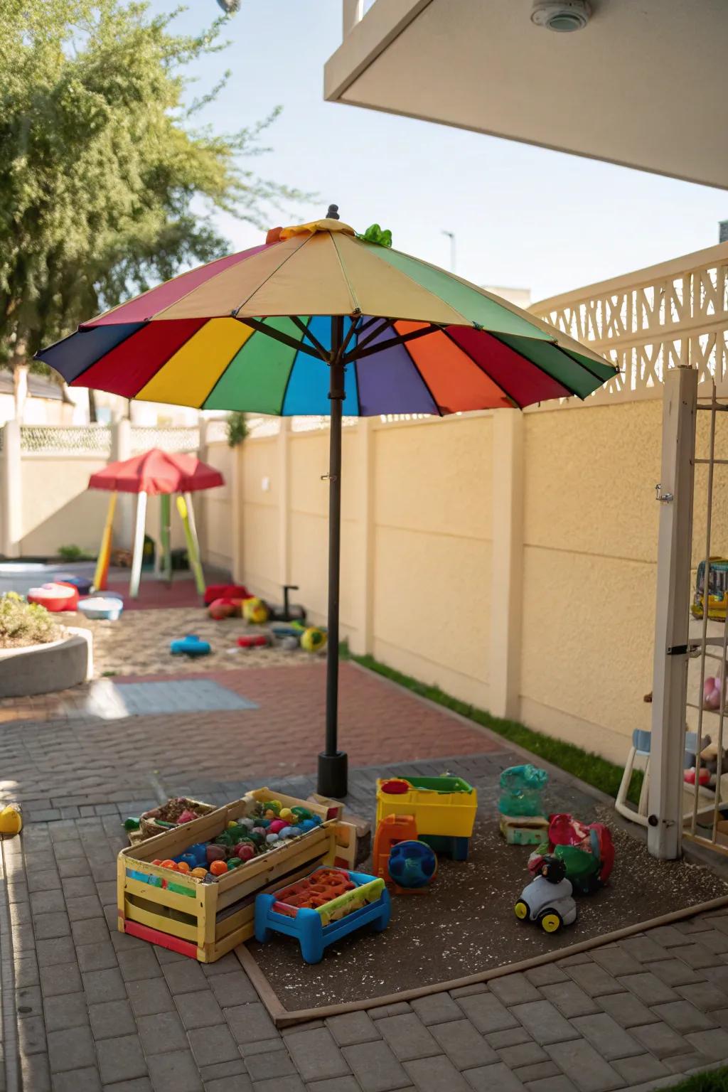 A shaded play area for children with a vibrant sunshade.