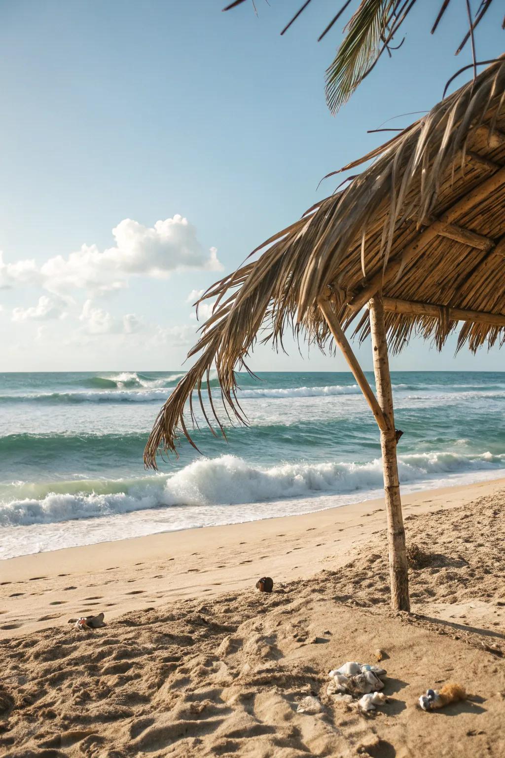 Palm leaf shelters provide an organic and sustainable beach sanctuary.