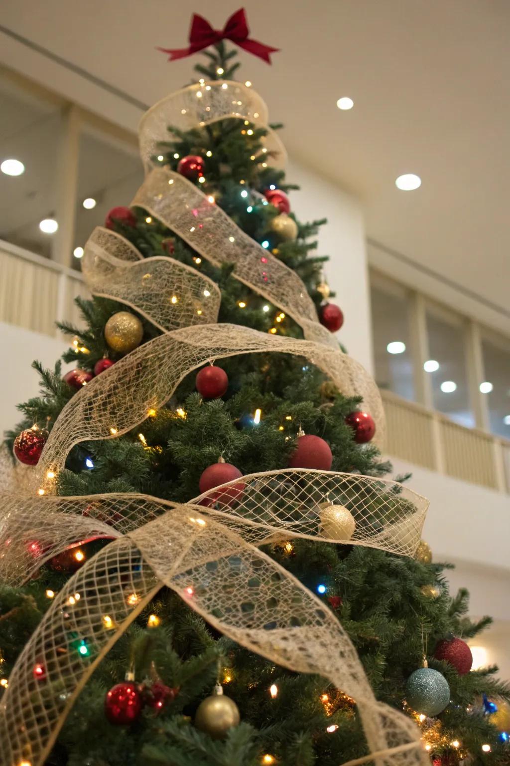 A Christmas tree with netted ribbons interlaced through the branches, introducing texture and dimension.