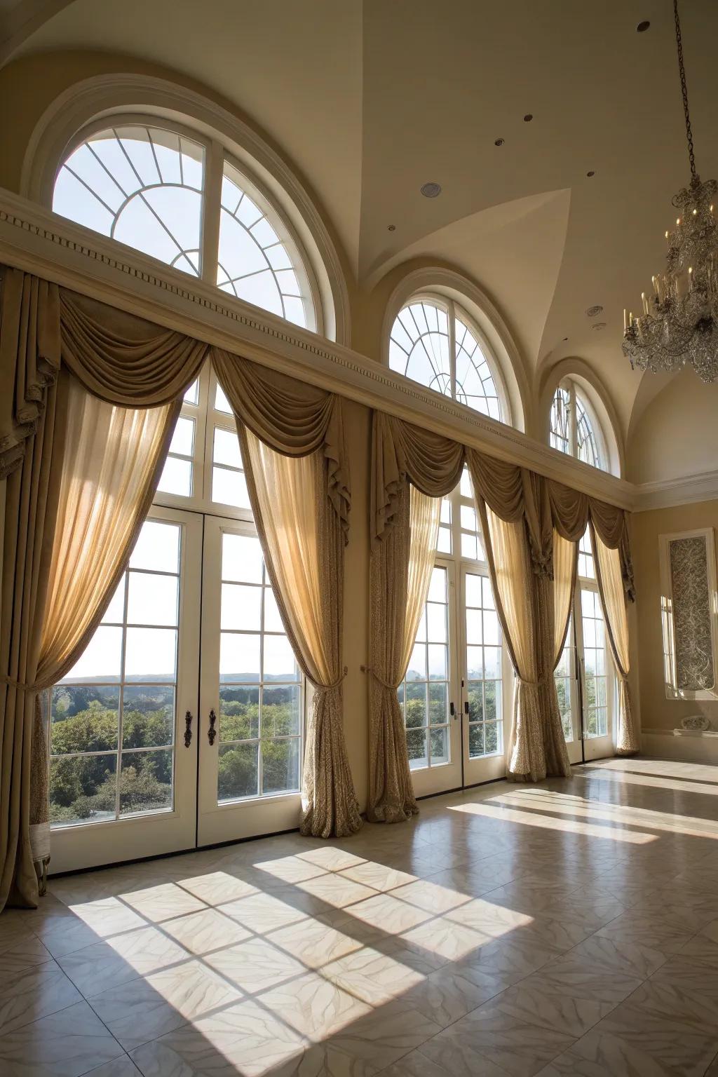 A grand living quarter features ceiling-hung hangings on arched windows, fostering a sense of spaciousness and grandeur.