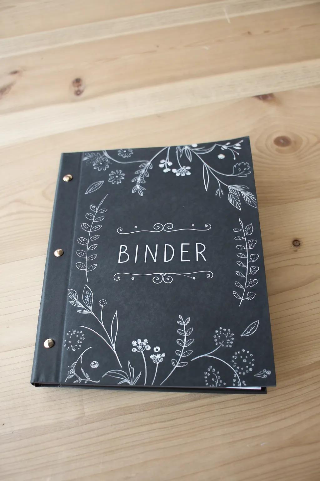 Elevate your binder game with a chic chalkboard design, where simplicity meets artistic flair.