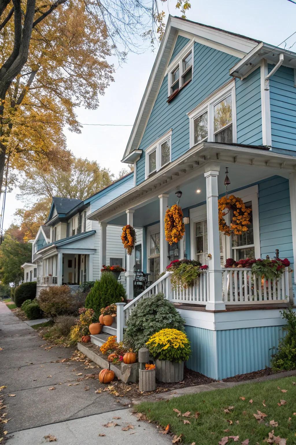 Seasonal decor keeps your blue house vibrant and inviting.