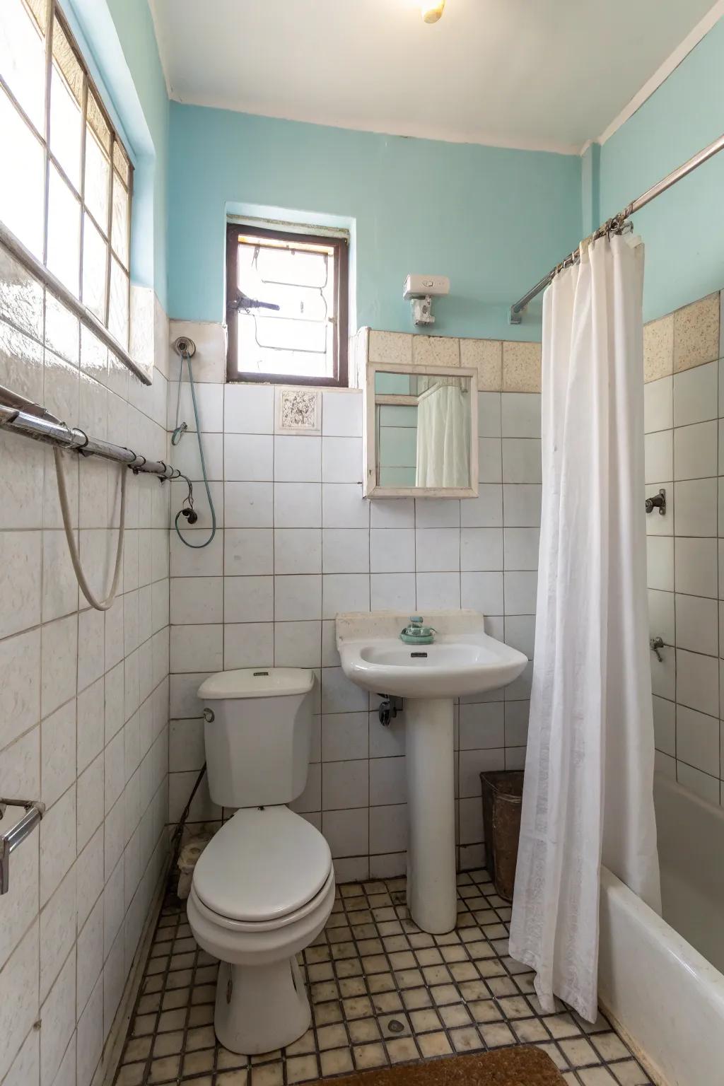 Inexpensive materials give this compact bathroom style.
