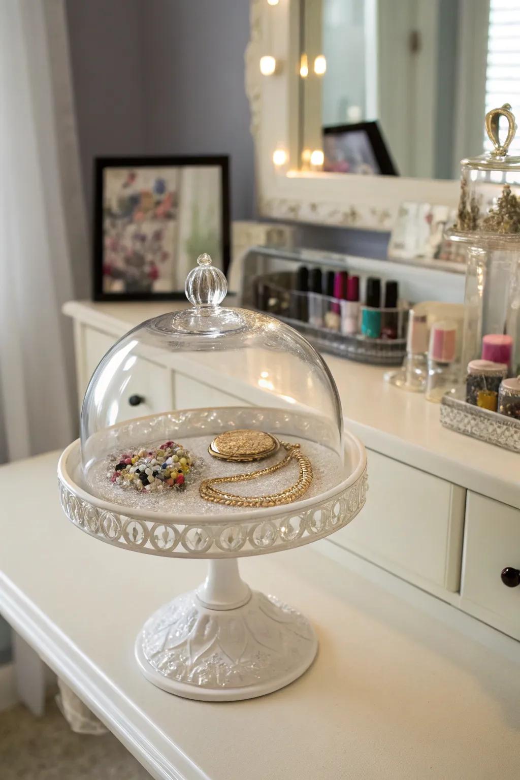 Fashionably organize your jewelry accessories beneath a glass dome.