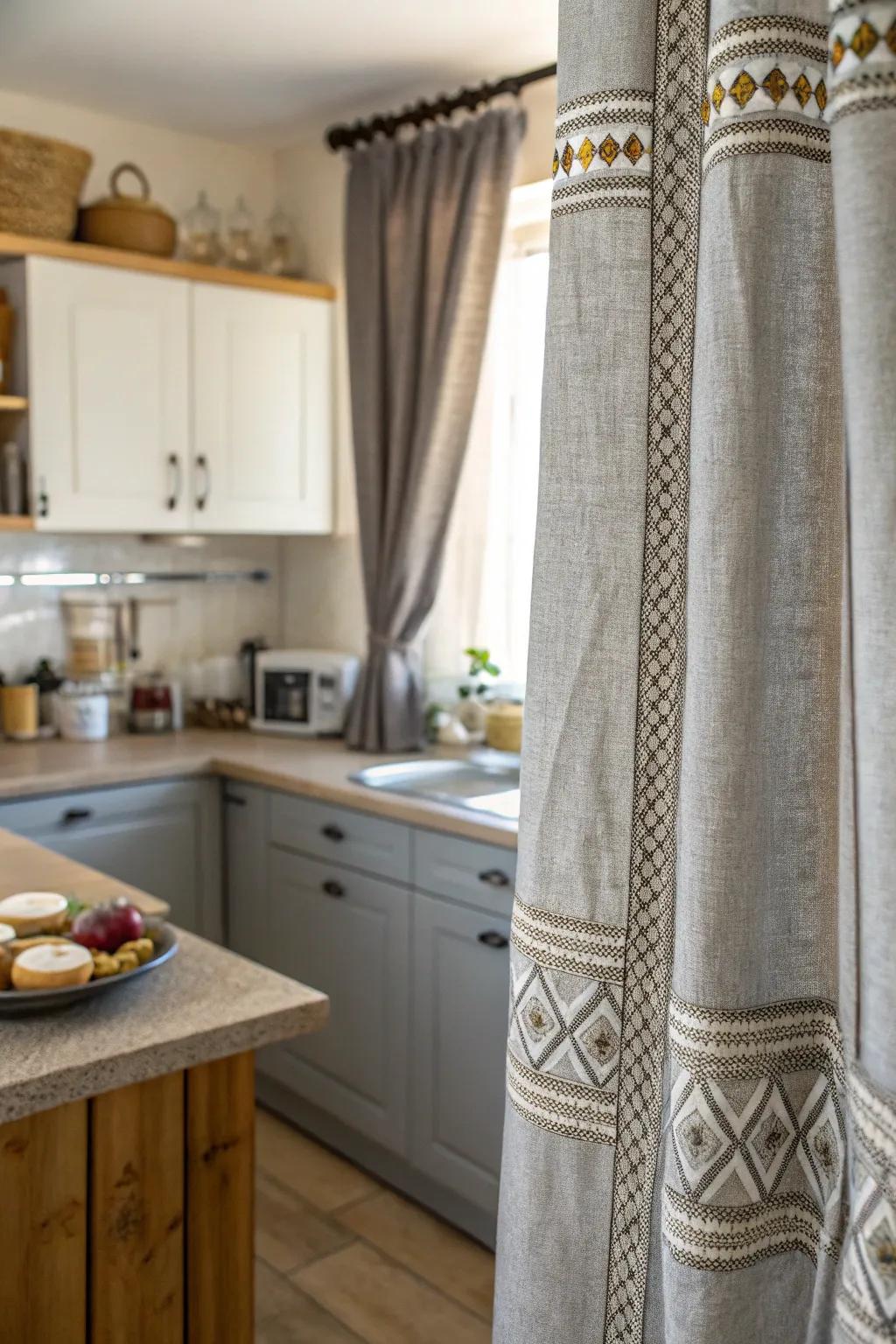 Textured gray drapes add a tactile richness to the kitchen.