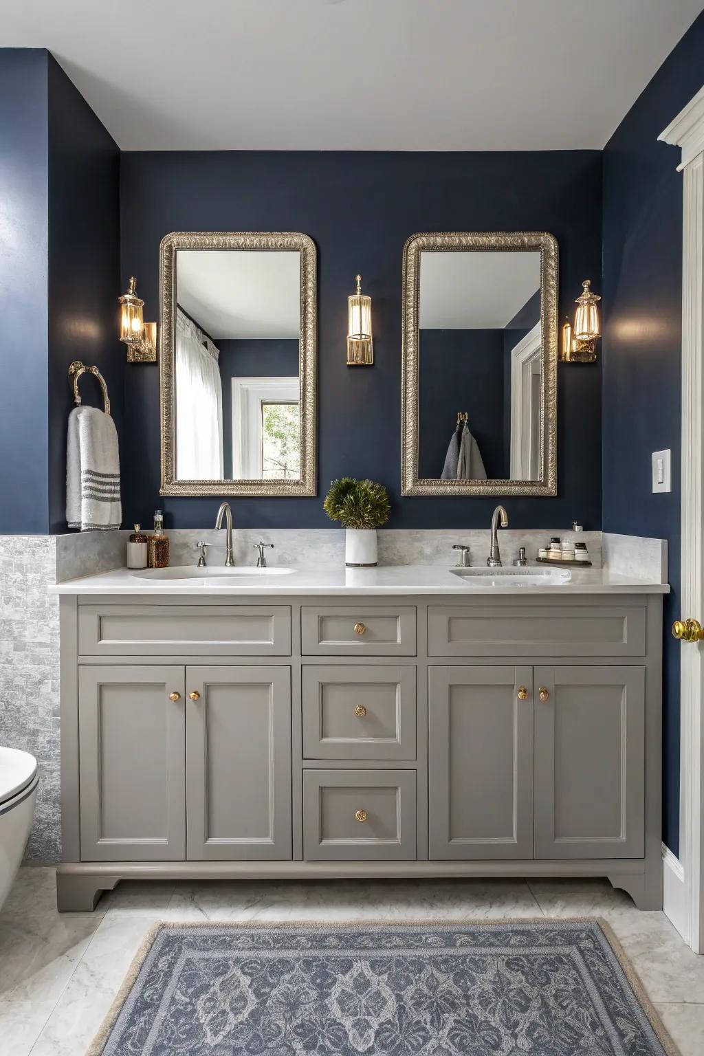A bold bathroom design features a striking contrast between the gray vanity and navy wall.
