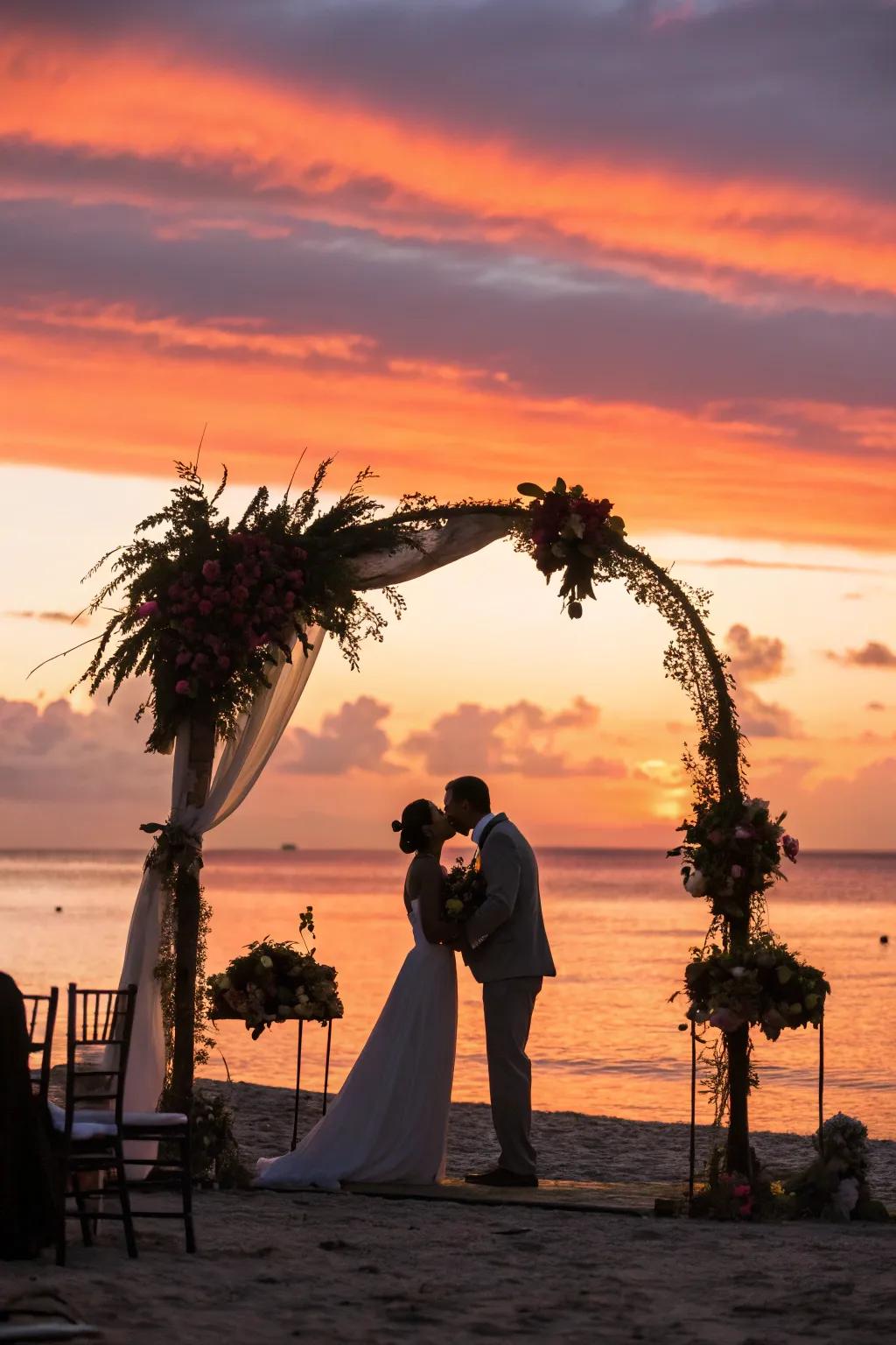 A spectacular wedding arch positioned against a vibrant dusk background.