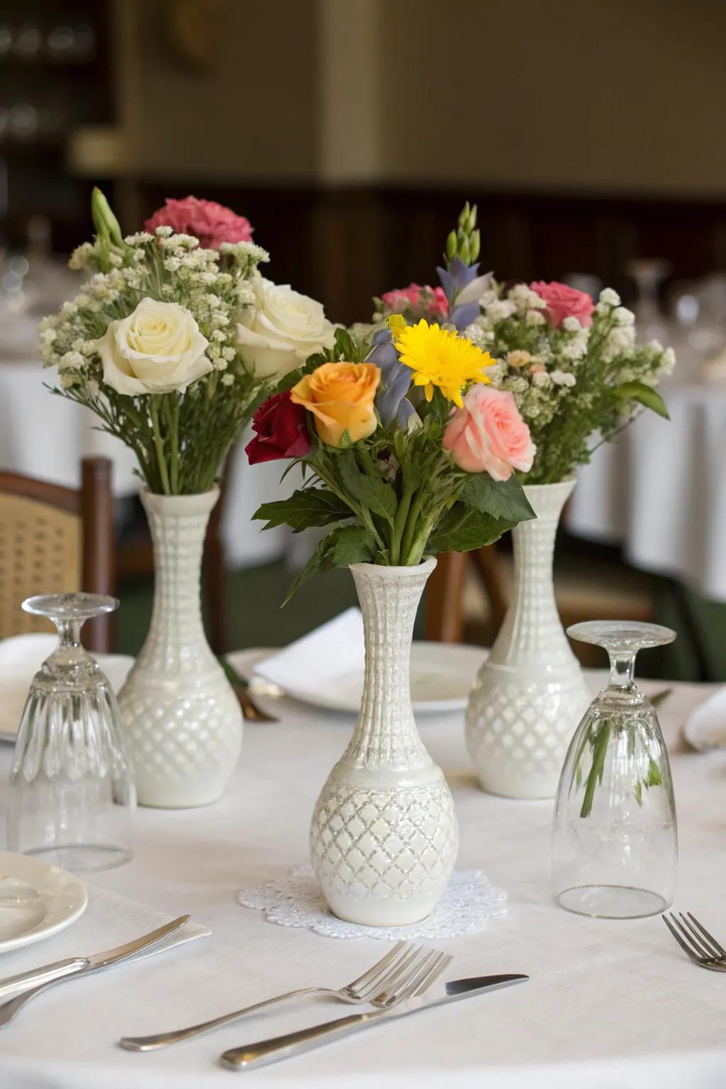 A dining table with a trio of vases arranged elegantly.