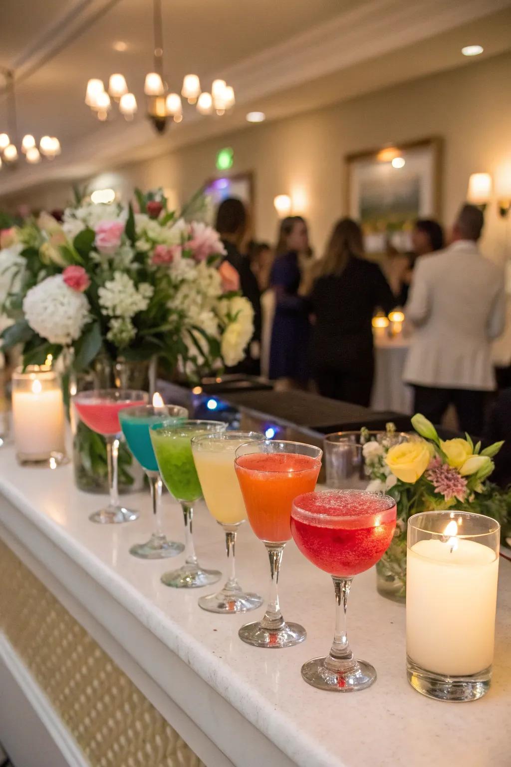 A spectrum of cocktails is artfully arranged, showcasing the joy of a rainbow-themed wedding.