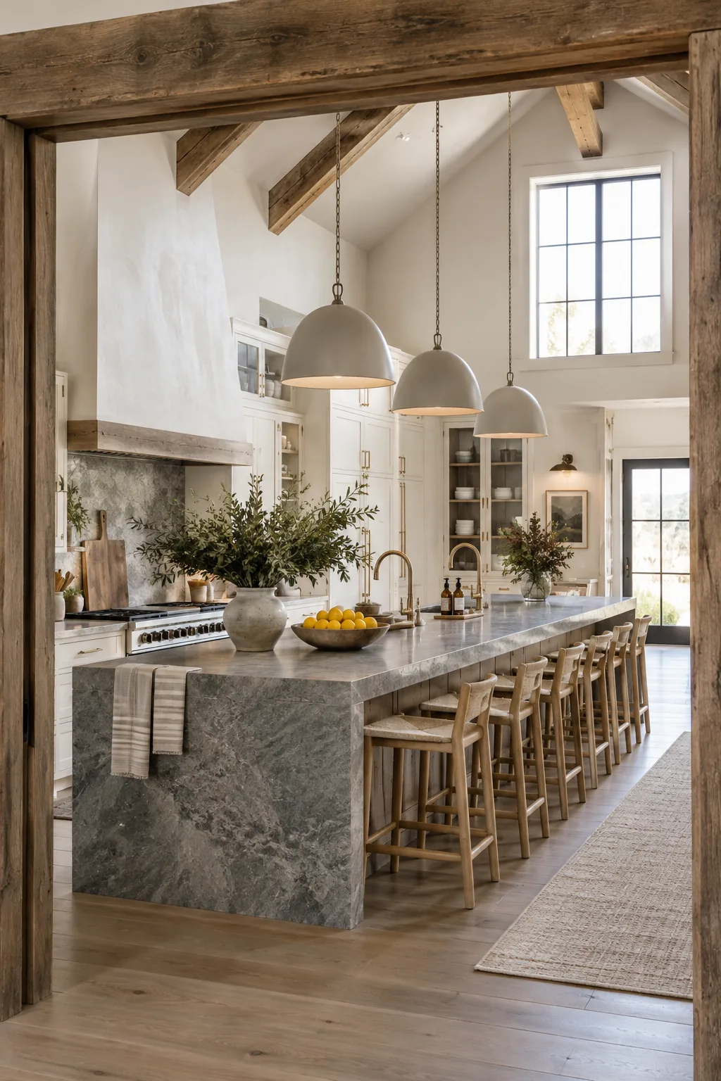Extra long kitchen island with leathered granite counter and bar stools.