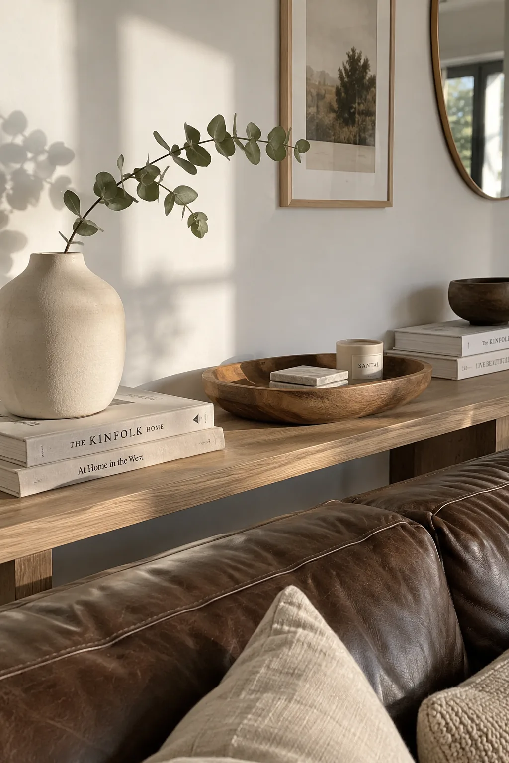 White living room with a dark brown leather couch