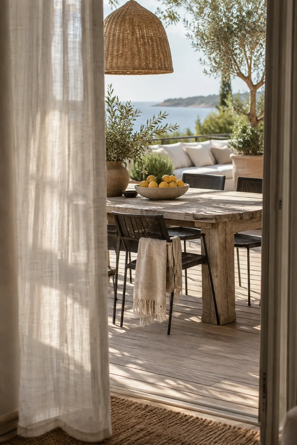 Weathered wood dining table paired with modern black metal chairs