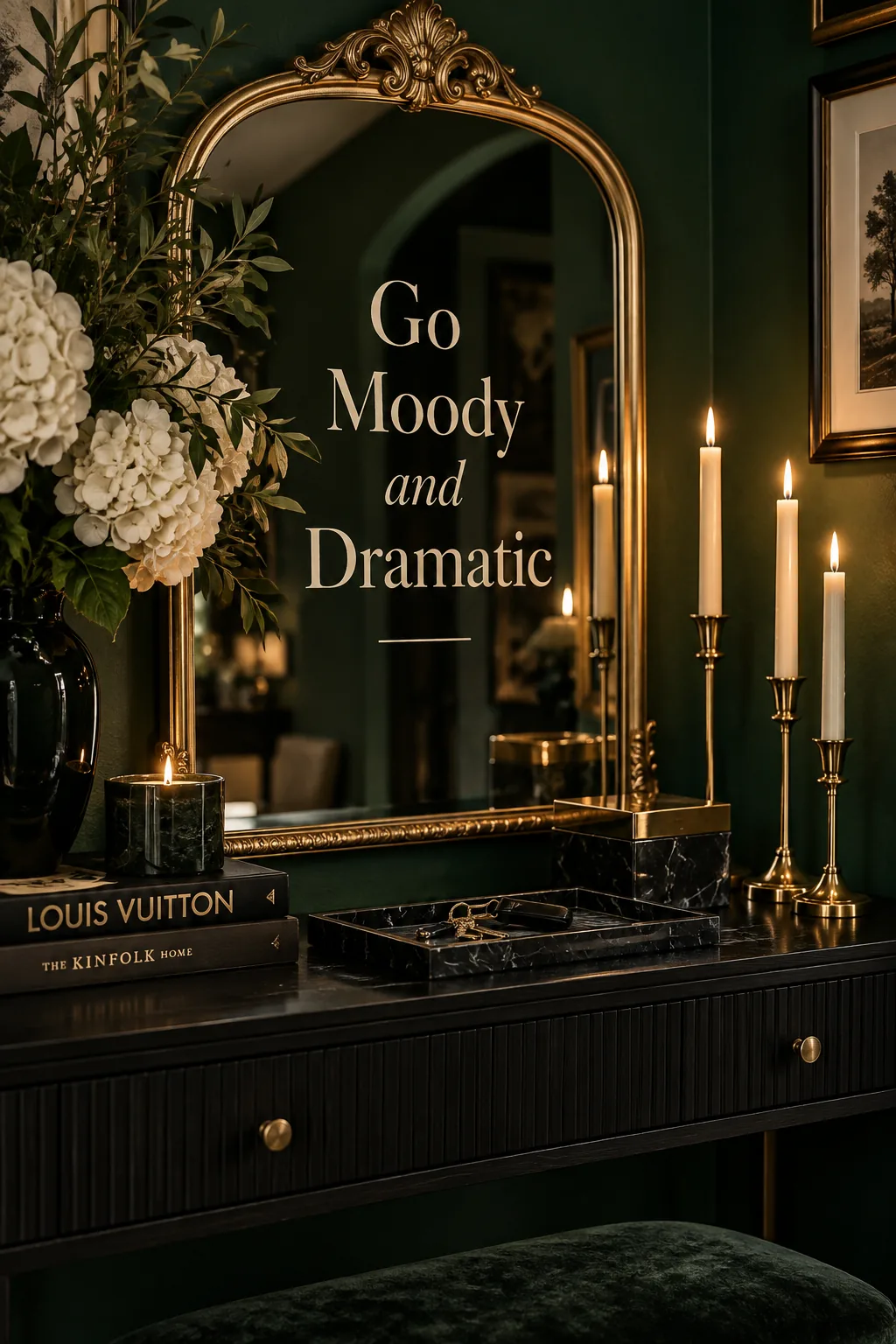 Moody dark green entryway with a gold mirror and black marble tray.