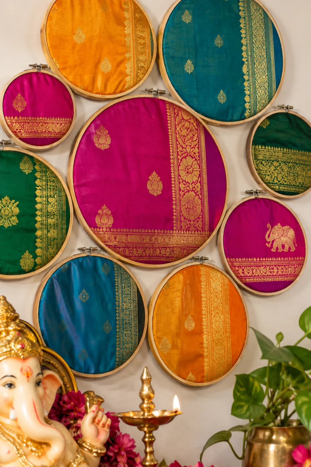 Colorful silk fabrics stretched inside wooden embroidery hoops on a wall