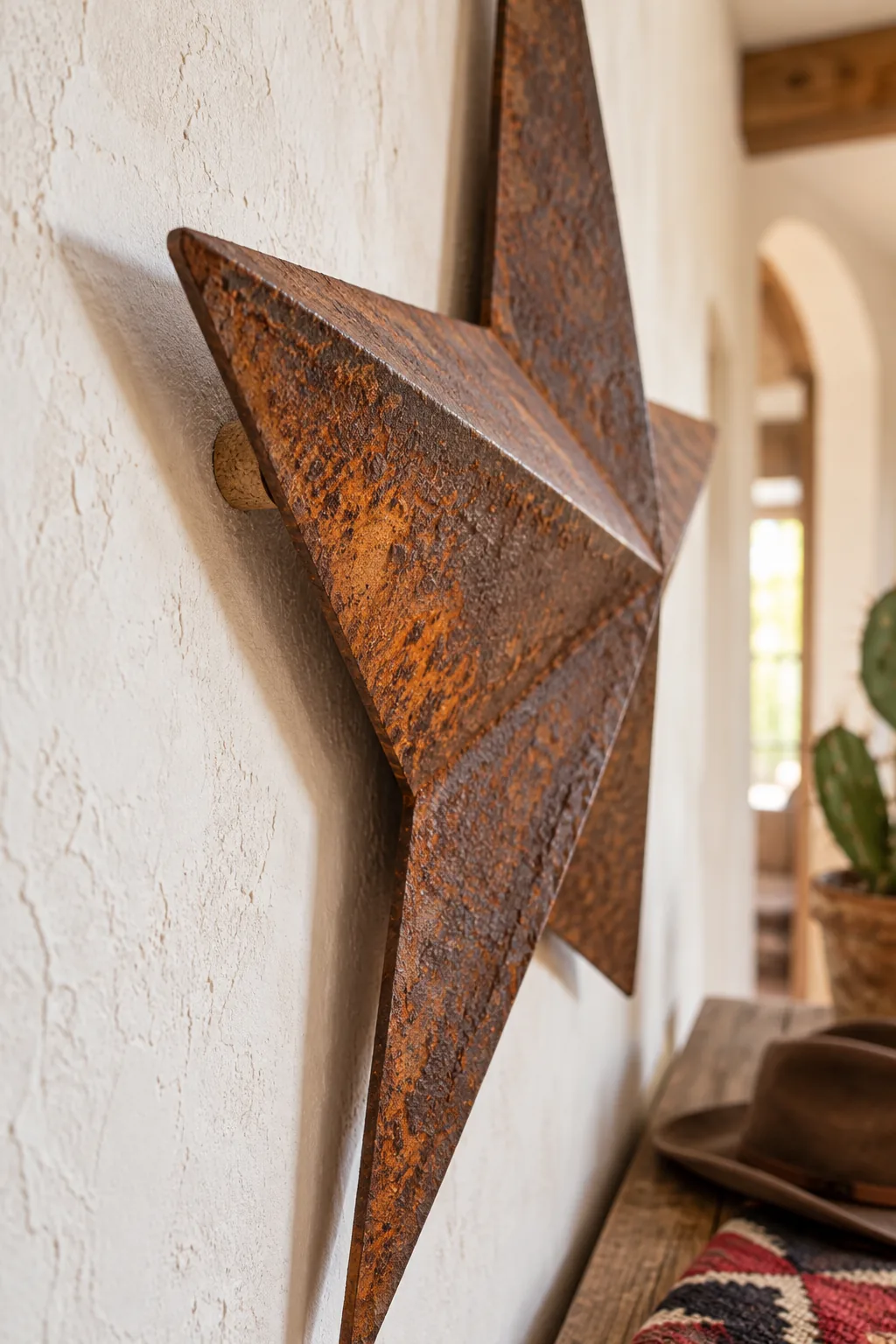 Extreme close-up of the deep orange and brown rust texture on a metal star.