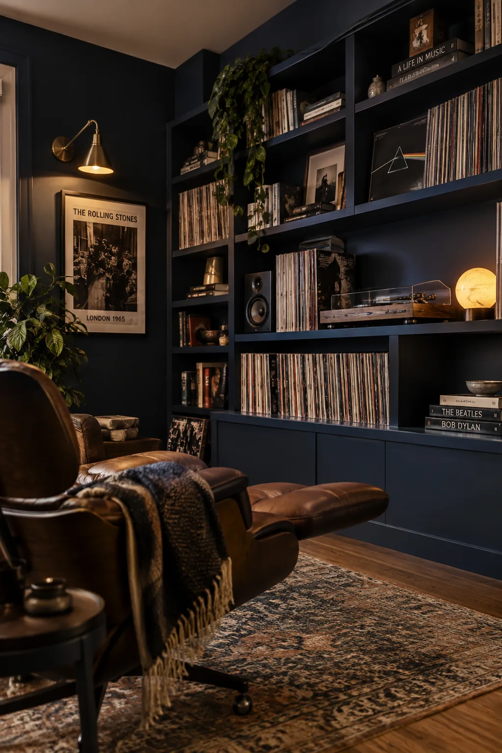 Built-in shelves painted the same dark color as the surrounding walls, filled with records