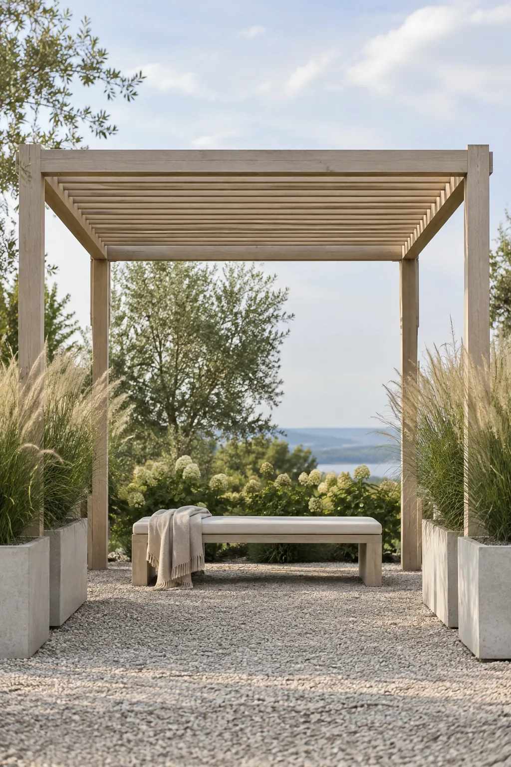 Minimalist freestanding pergola on a clean patio with ornamental grasses nearby