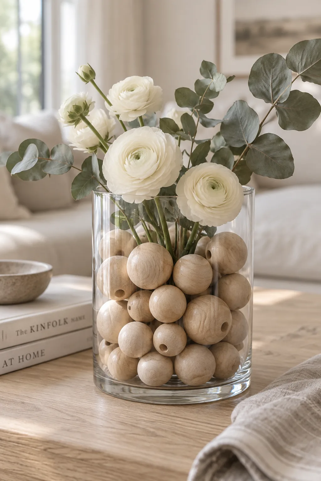 oversized raw wooden beads filling a glass hurricane vase